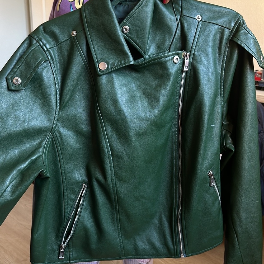 ELOQUII EUC green faux leather moto jacket.